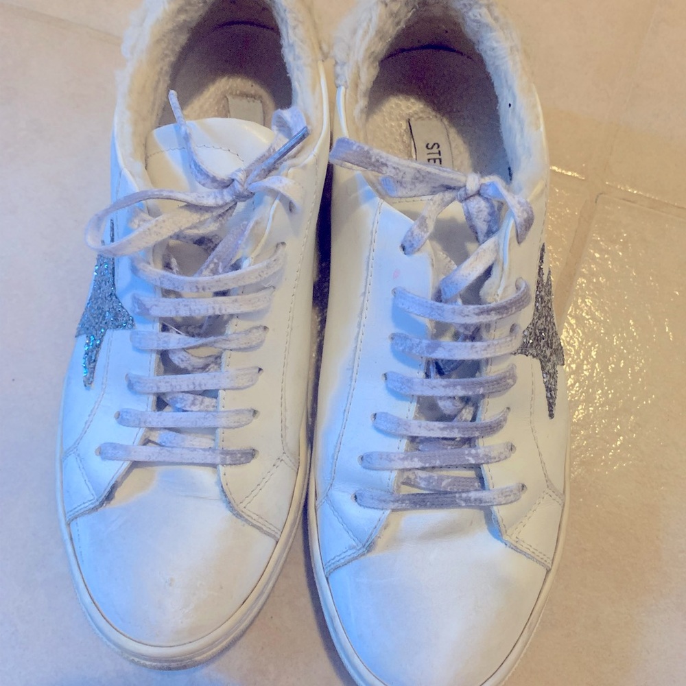 Steve Madden sneaker size 7.5.  Distressed look, glitter star and fur back.